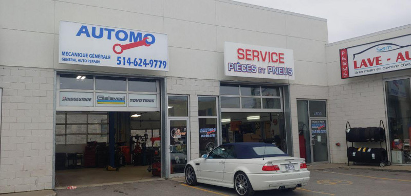 Modern auto repair workshop offering mechanical and tire services.